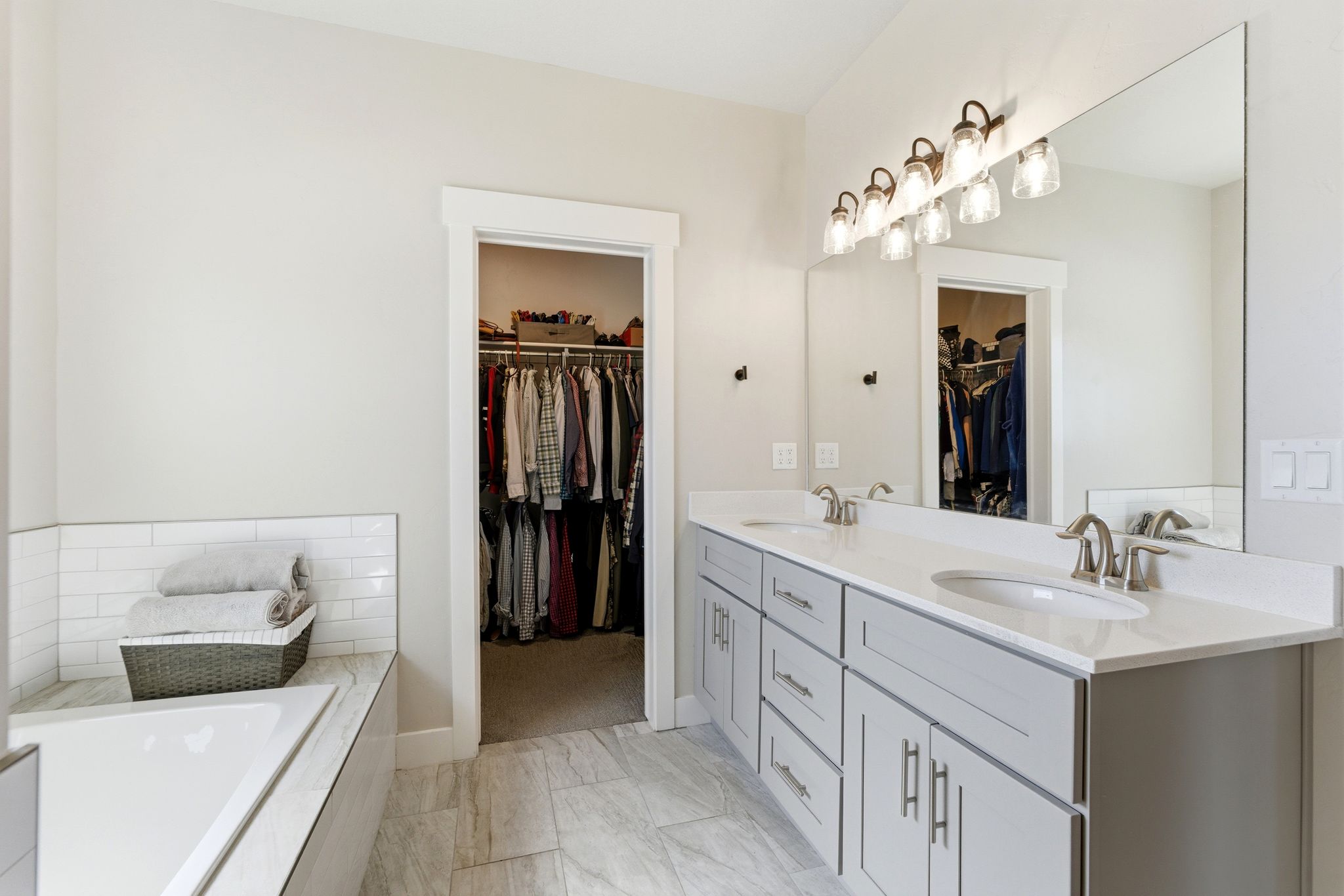 Primary bathroom with dual vanity.