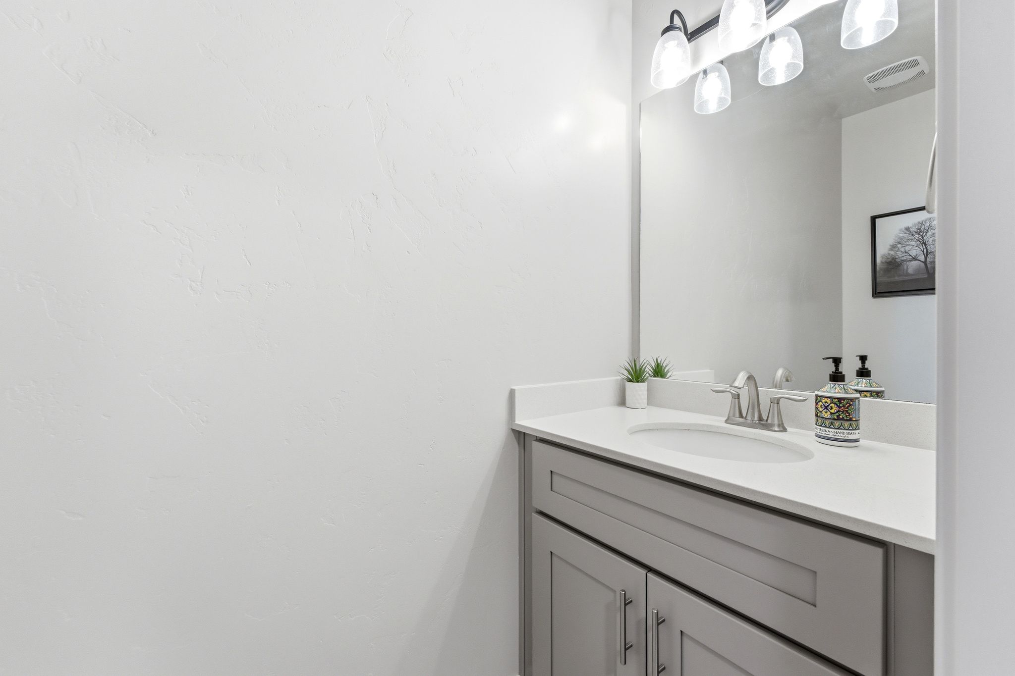 Half bath on the main floor across from laundry.