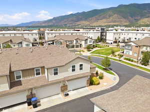 Residential community featuring townhomes with attached garages and shingle roofs