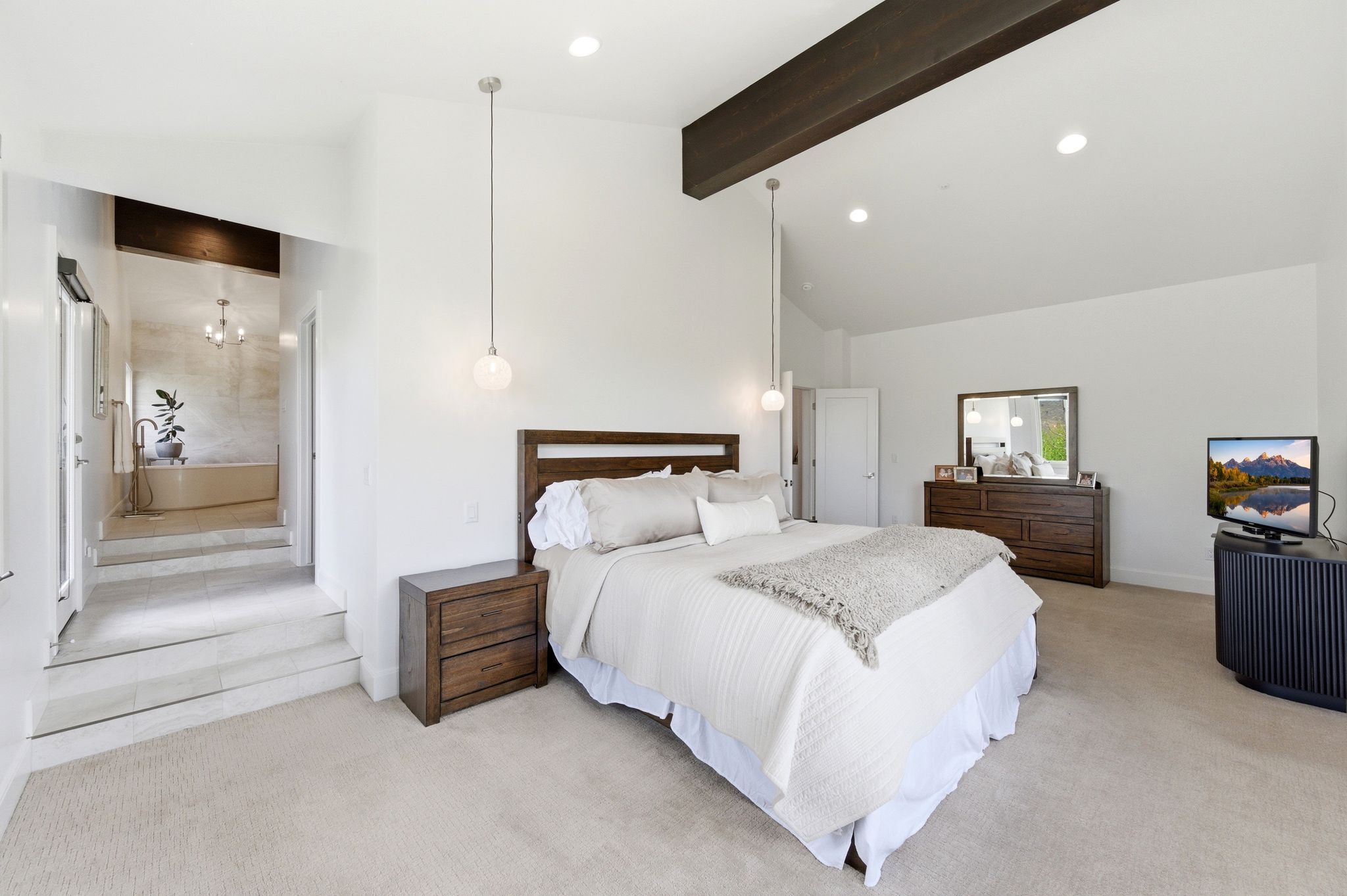 Vaulted ceiling with an exposed wood beam