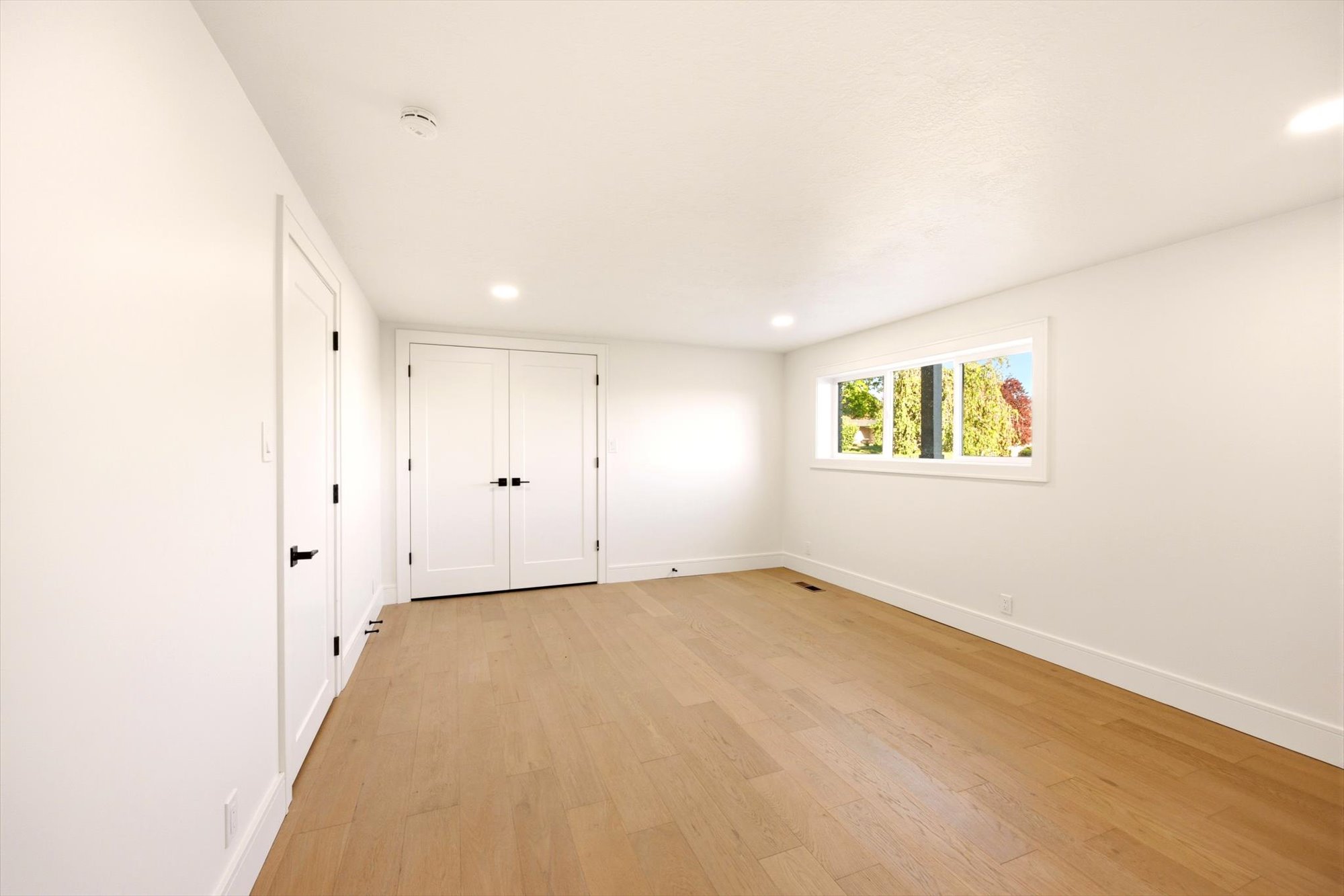 Bright interior space featuring light wood-finish flooring