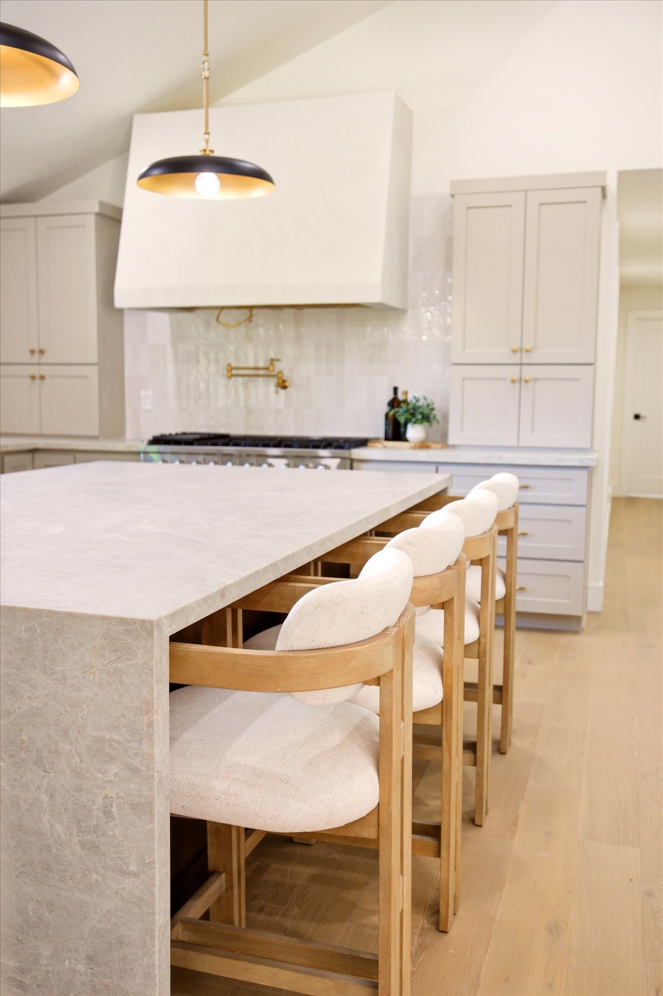 Waterfall island countertop with seating for four