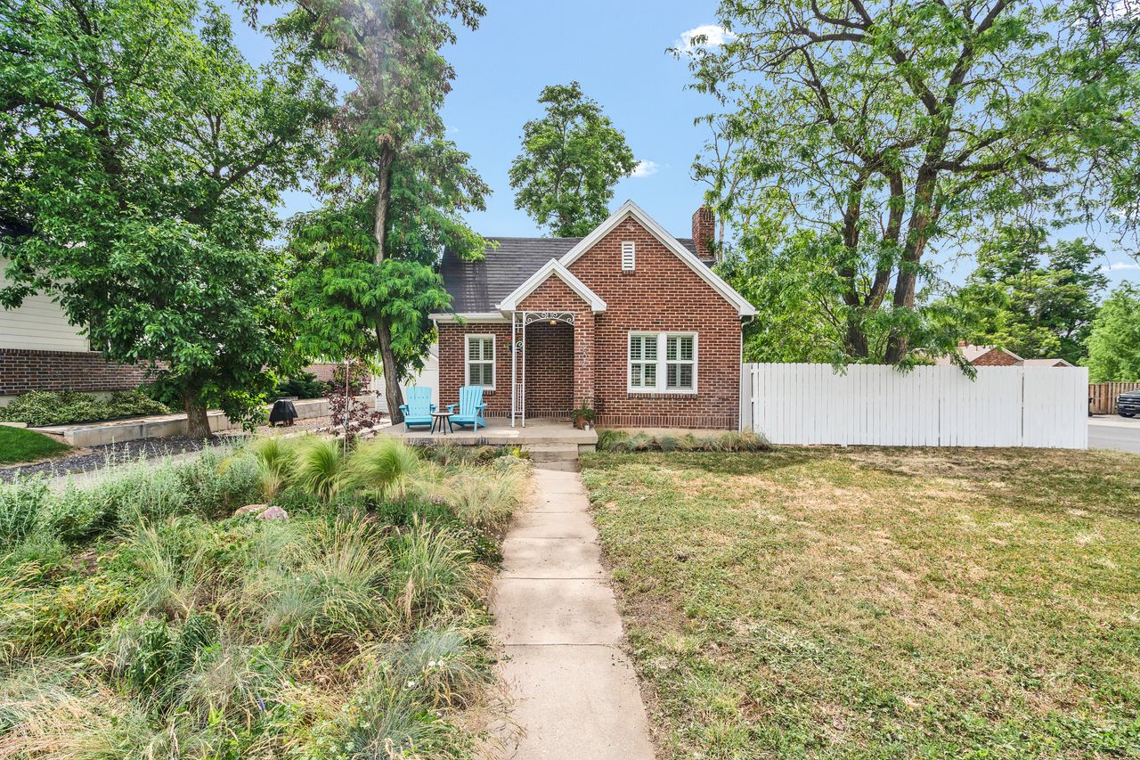 Red brick bungalow with a covered entry