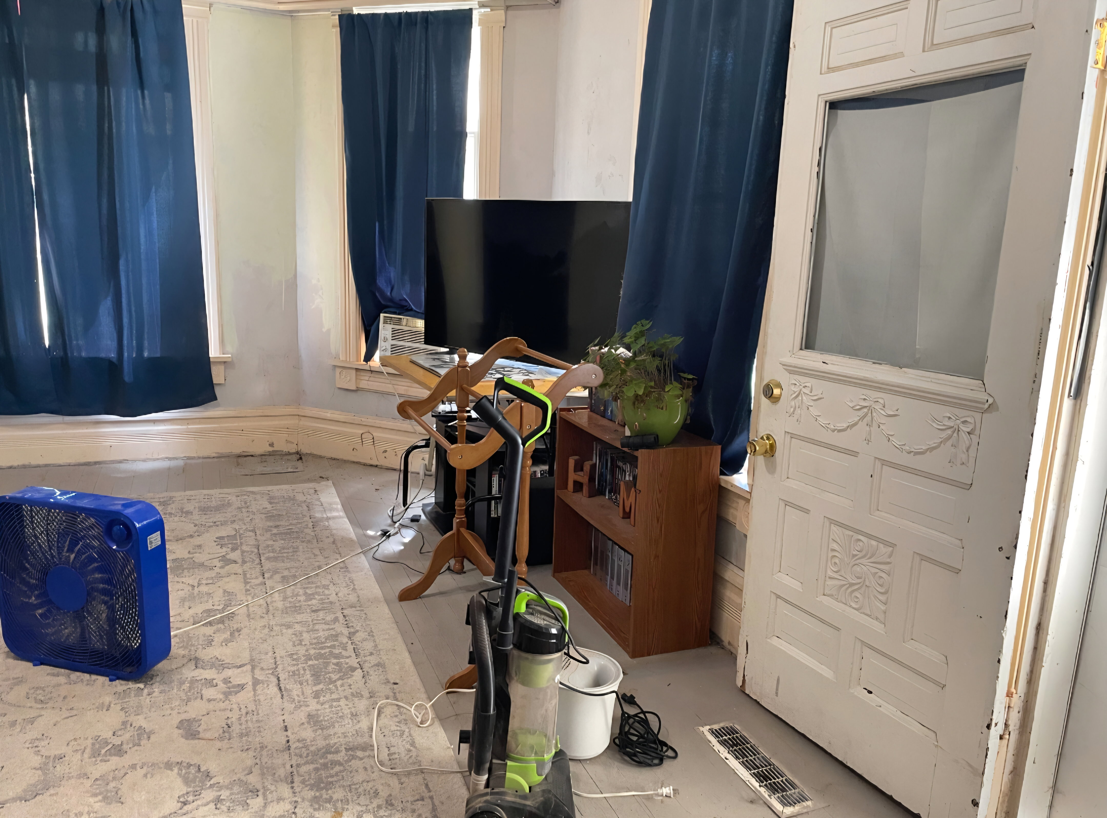 Room featuring multiple windows with window sills and baseboard trim