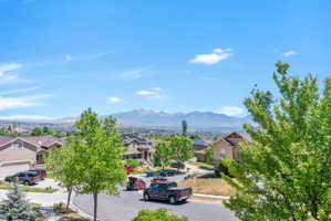 Panoramic neighborhood setting with distant snow-capped mountains