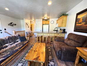 Open-concept living area featuring LVP flooring