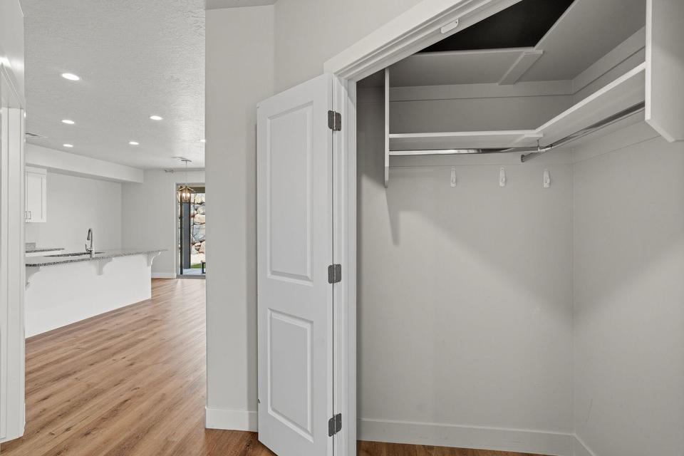 Open closet with integrated shelving and hanging rods