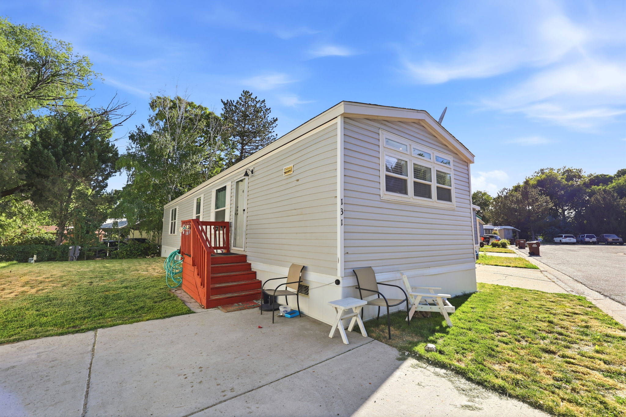 Light gray horizontal siding exterior with white trim
