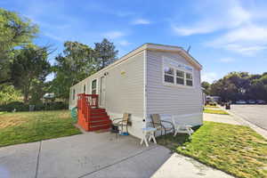 Light gray horizontal siding exterior with white trim
