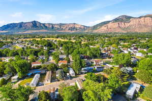 Expansive aerial perspective showcasing a residential area with lush green trees