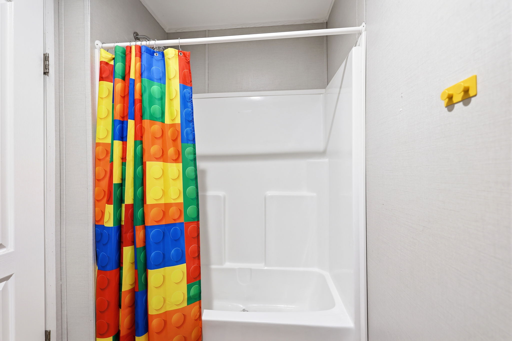 White fiberglass shower and tub combination
