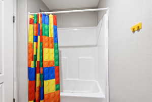 White fiberglass shower and tub combination