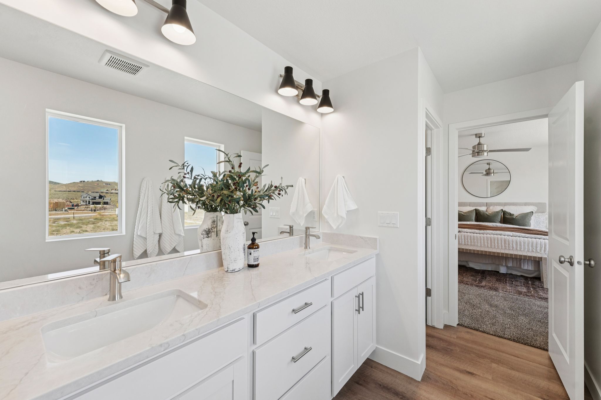 Dual vanity with a stone-look countertop and under-mount sinks