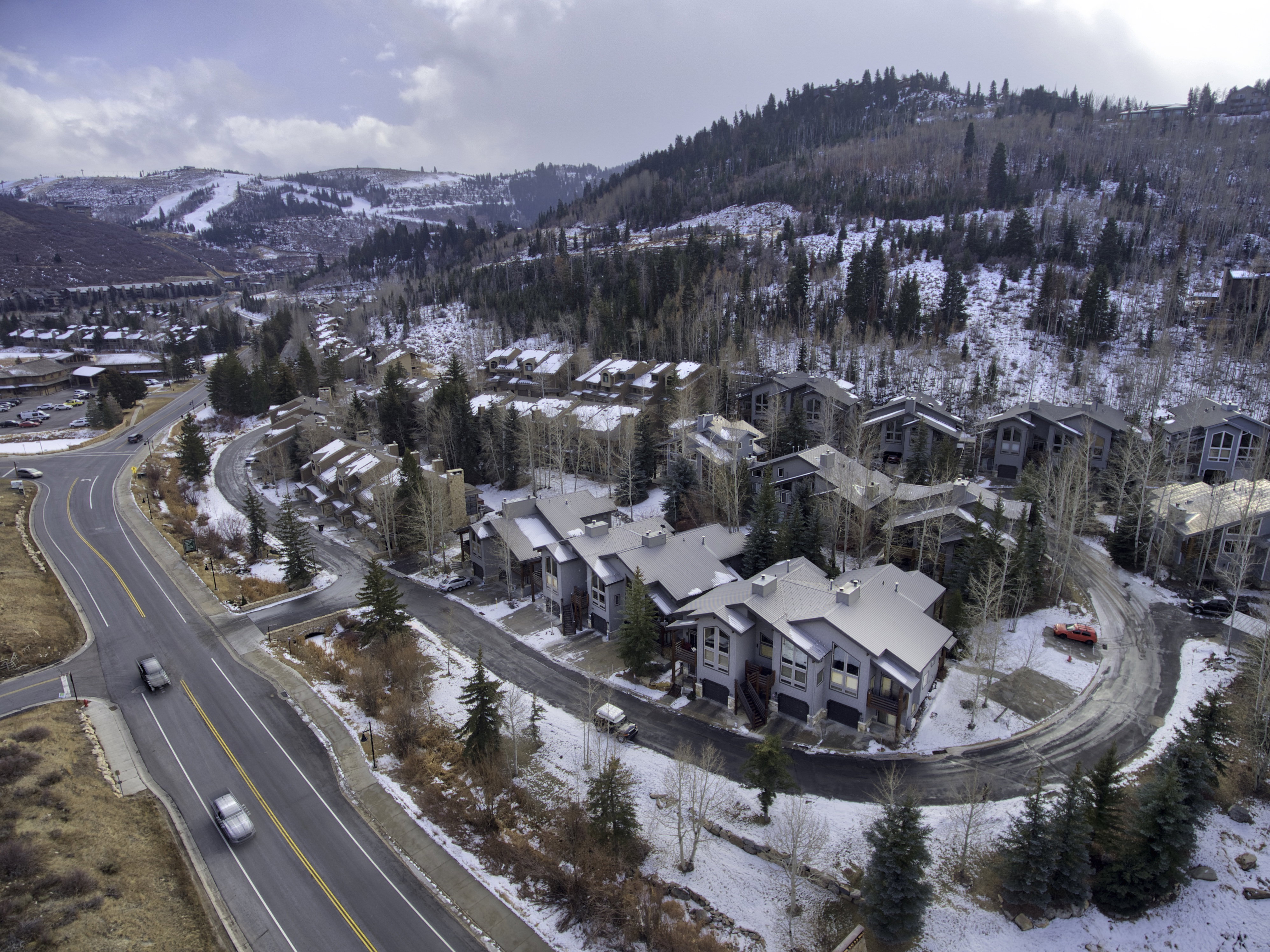 Aerial perspective of a multi-unit property featuring contemporary architectural styles