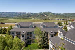 Multi-story residential complex featuring multiple balconies and dormer windows
