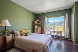 Expansive window featuring distant mountain and field scenery