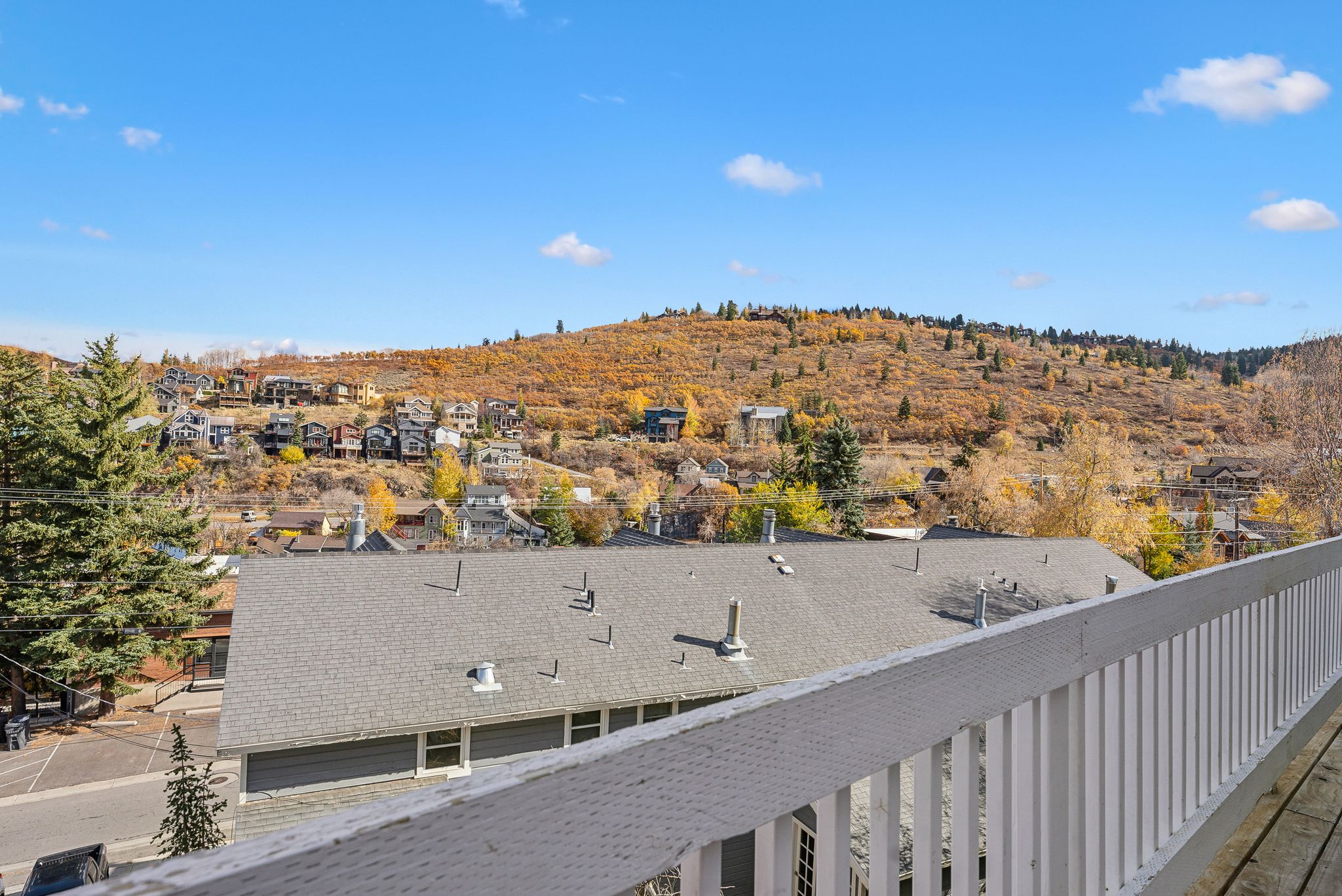Expansive mountain and community scenery from a private balcony