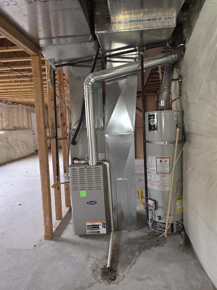 Furnace and water heater systems feature a concrete floor with a floor drain