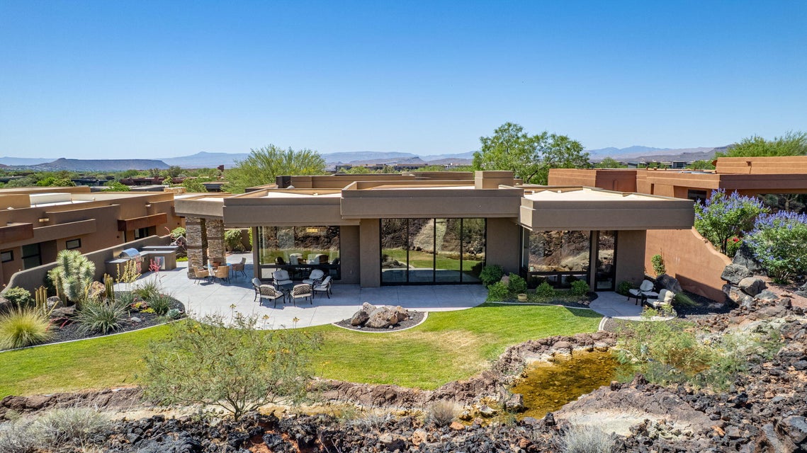 Modern desert architecture with a flat roofline and extensive glass paneling