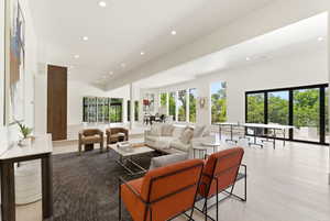 Spacious interior featuring high vaulted ceilings, recessed lighting, and light wood-finish flooring