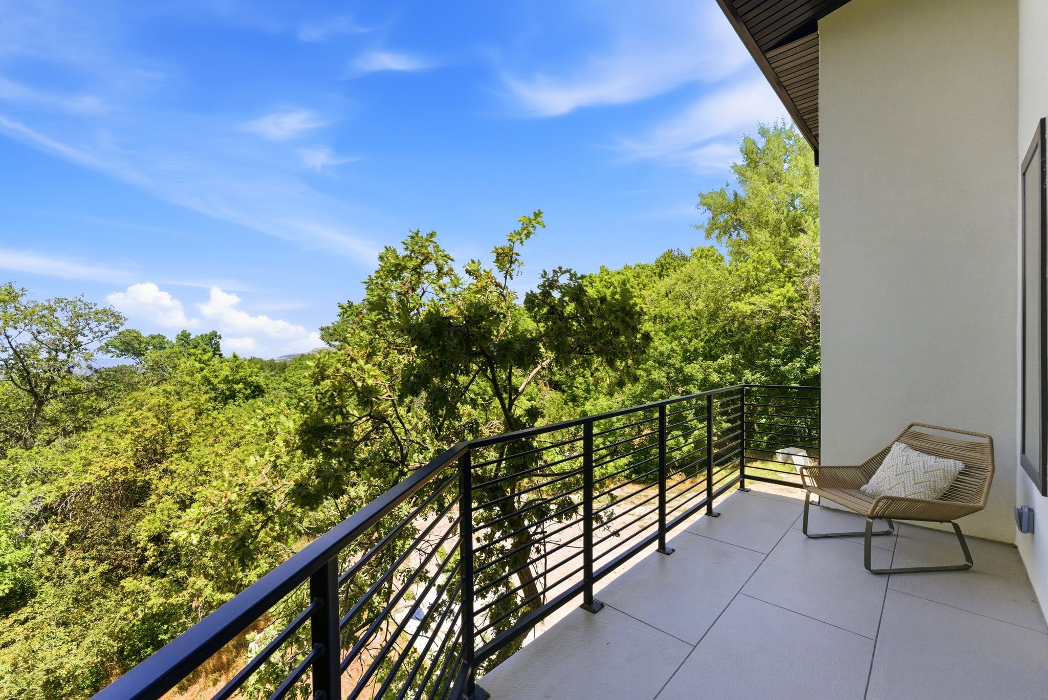 Exterior balcony featuring a metal railing system
