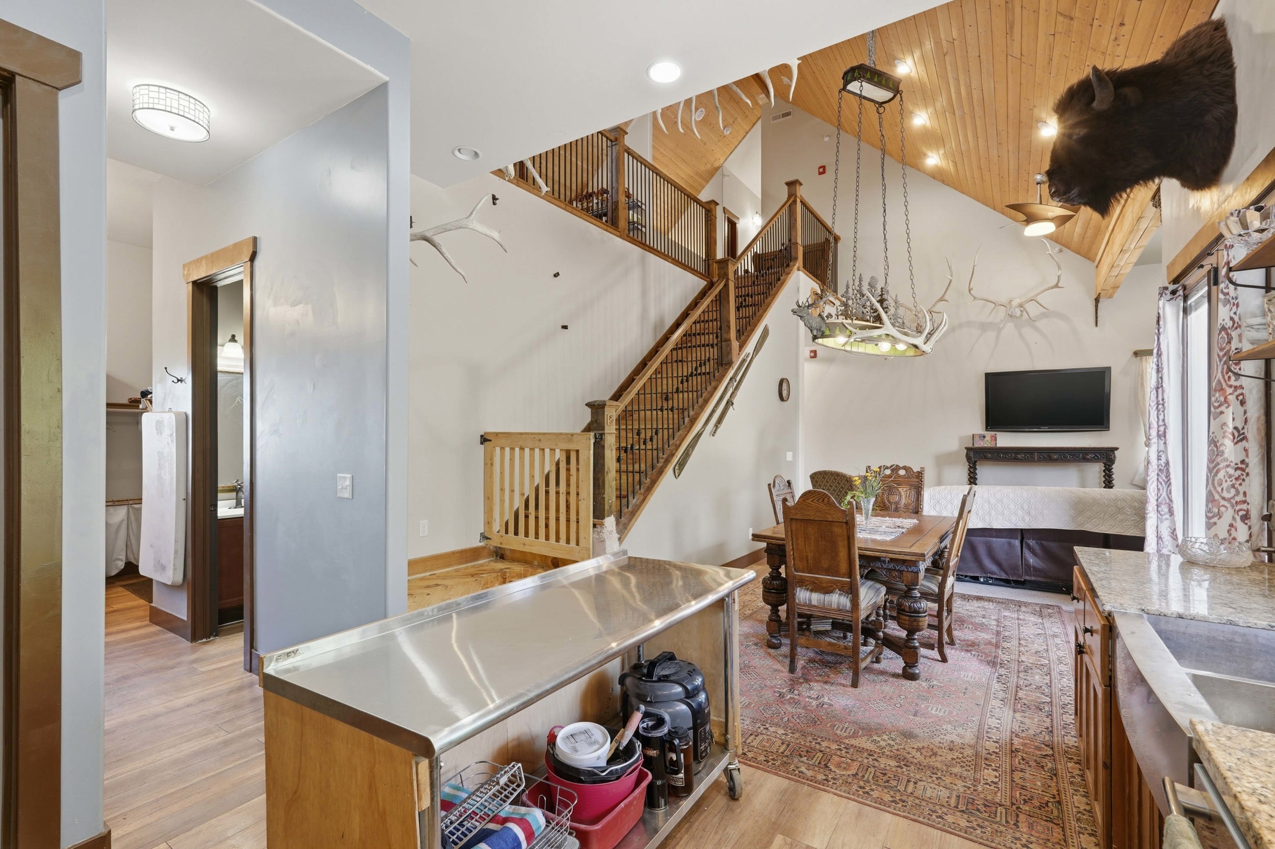 Vaulted wood-paneled ceiling featuring recessed lighting