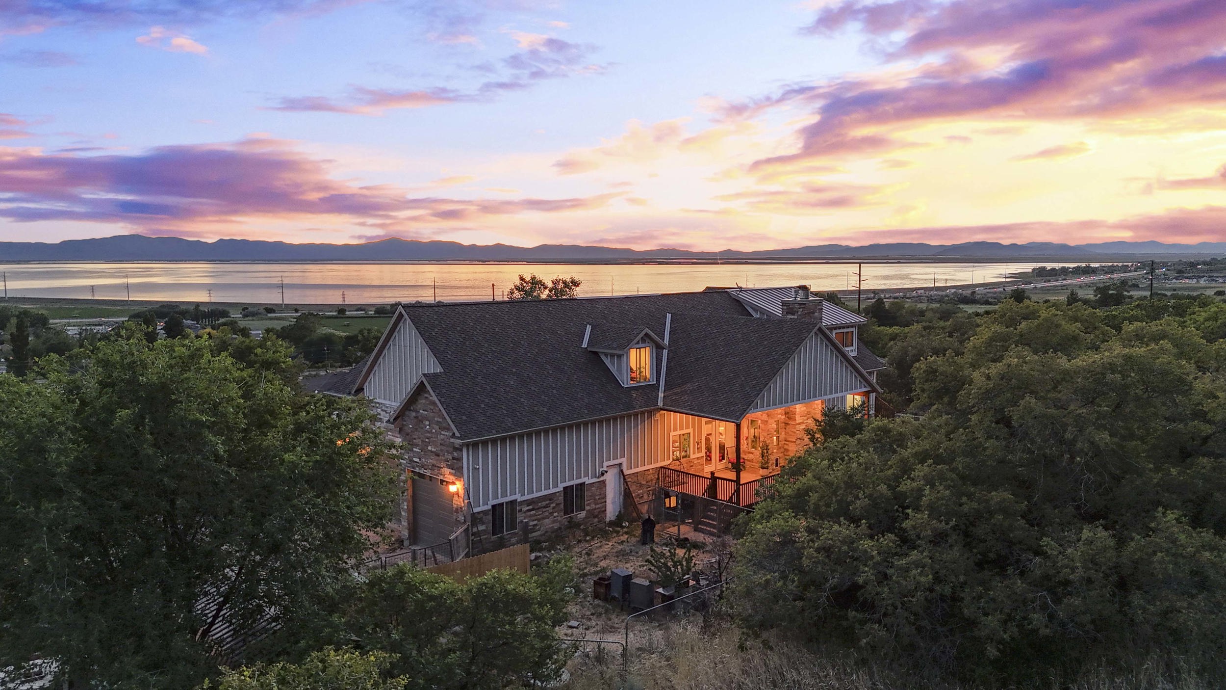 Stone and siding exterior with a multi-gabled roofline