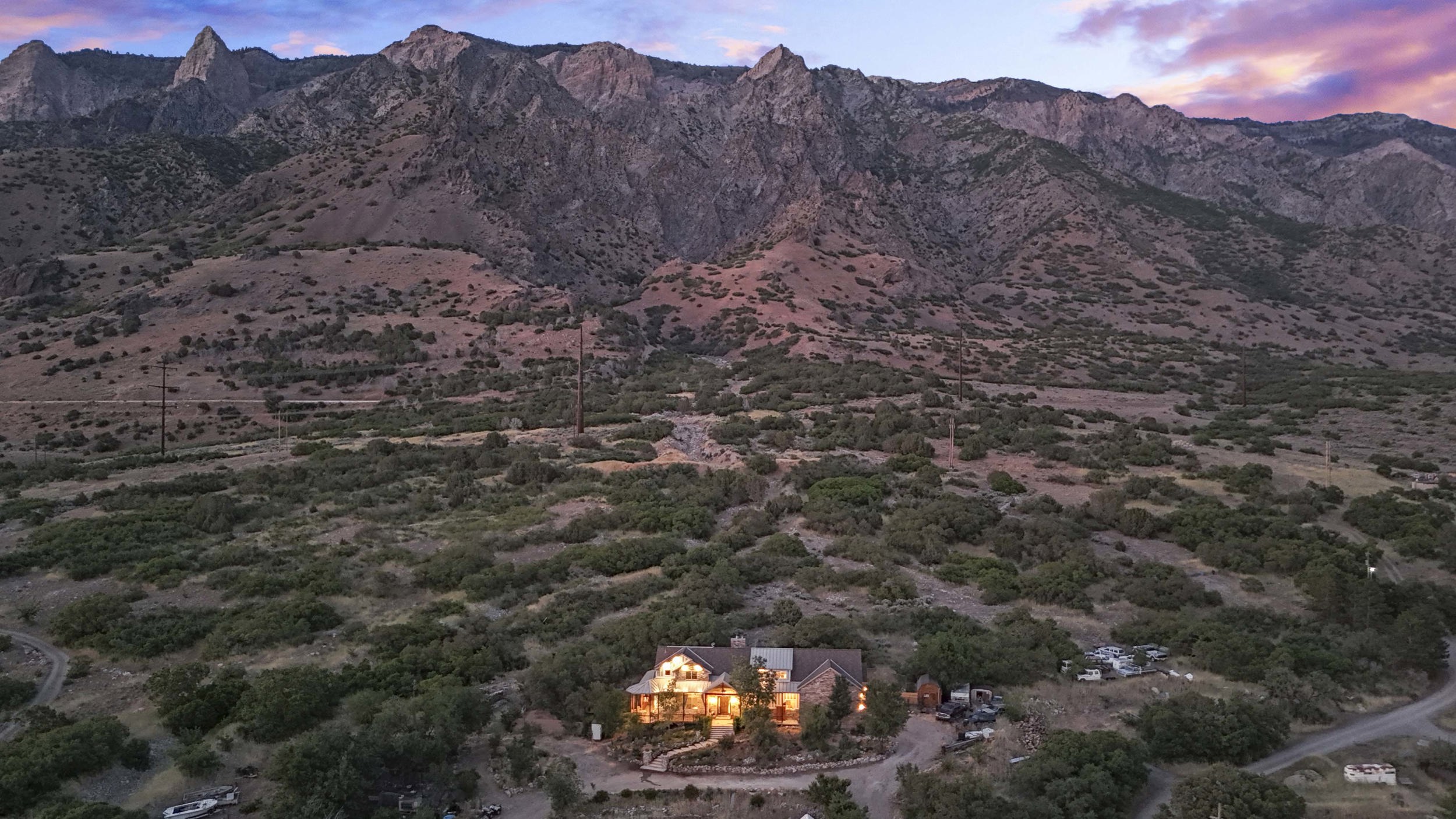 Mountain backdrop with expansive natural landscaping surrounding the property