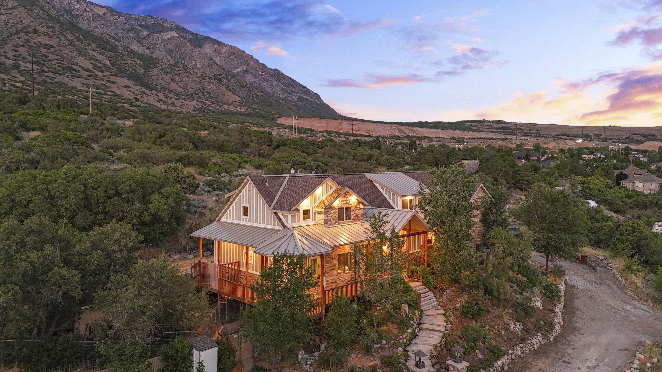 Mountain-side residence featuring a multi-level design with extensive wood decking