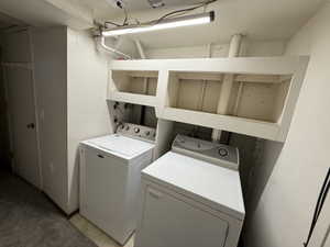 Dedicated laundry area featuring built-in shelving.