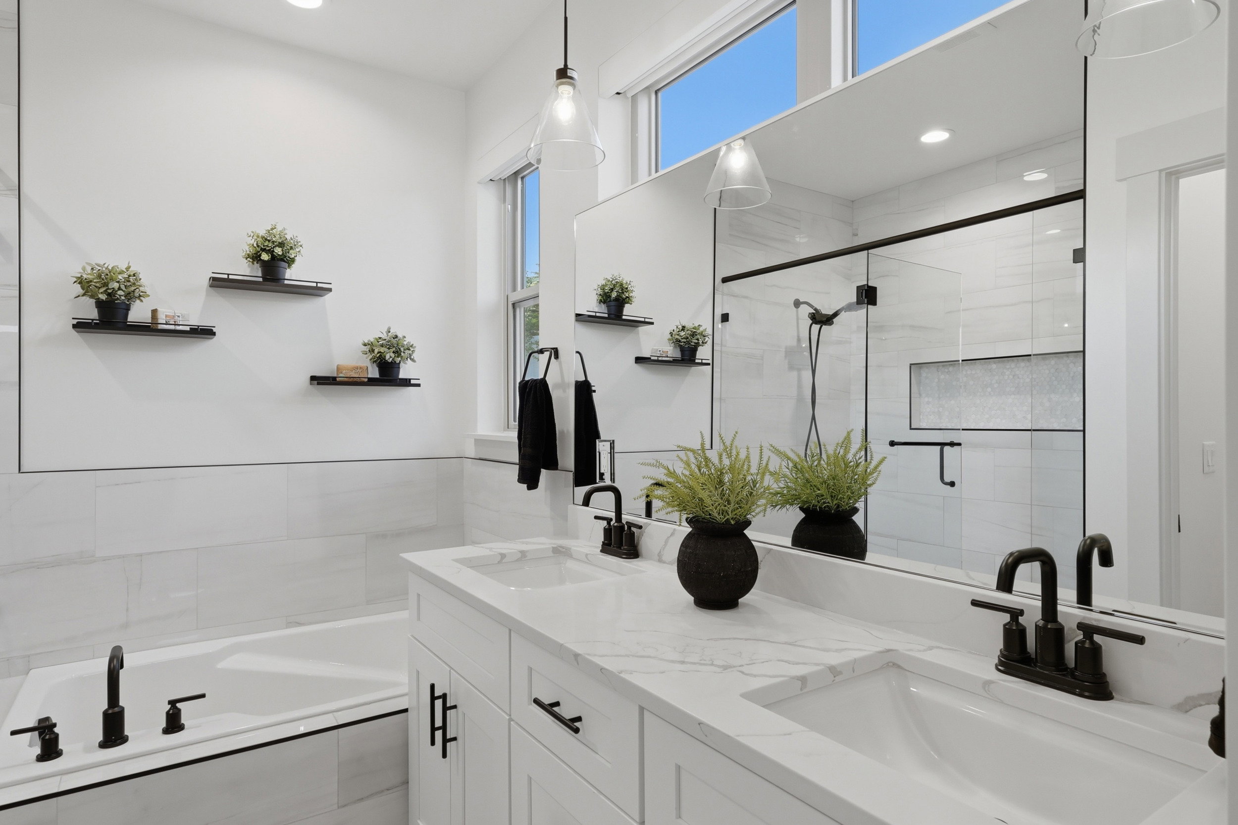 Primary Bathroom, Dual sink vanity with stone-finish countertop, undermount sinks, and matte black fixtures