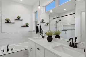 Primary Bathroom, Dual sink vanity with stone-finish countertop, undermount sinks, and matte black fixtures