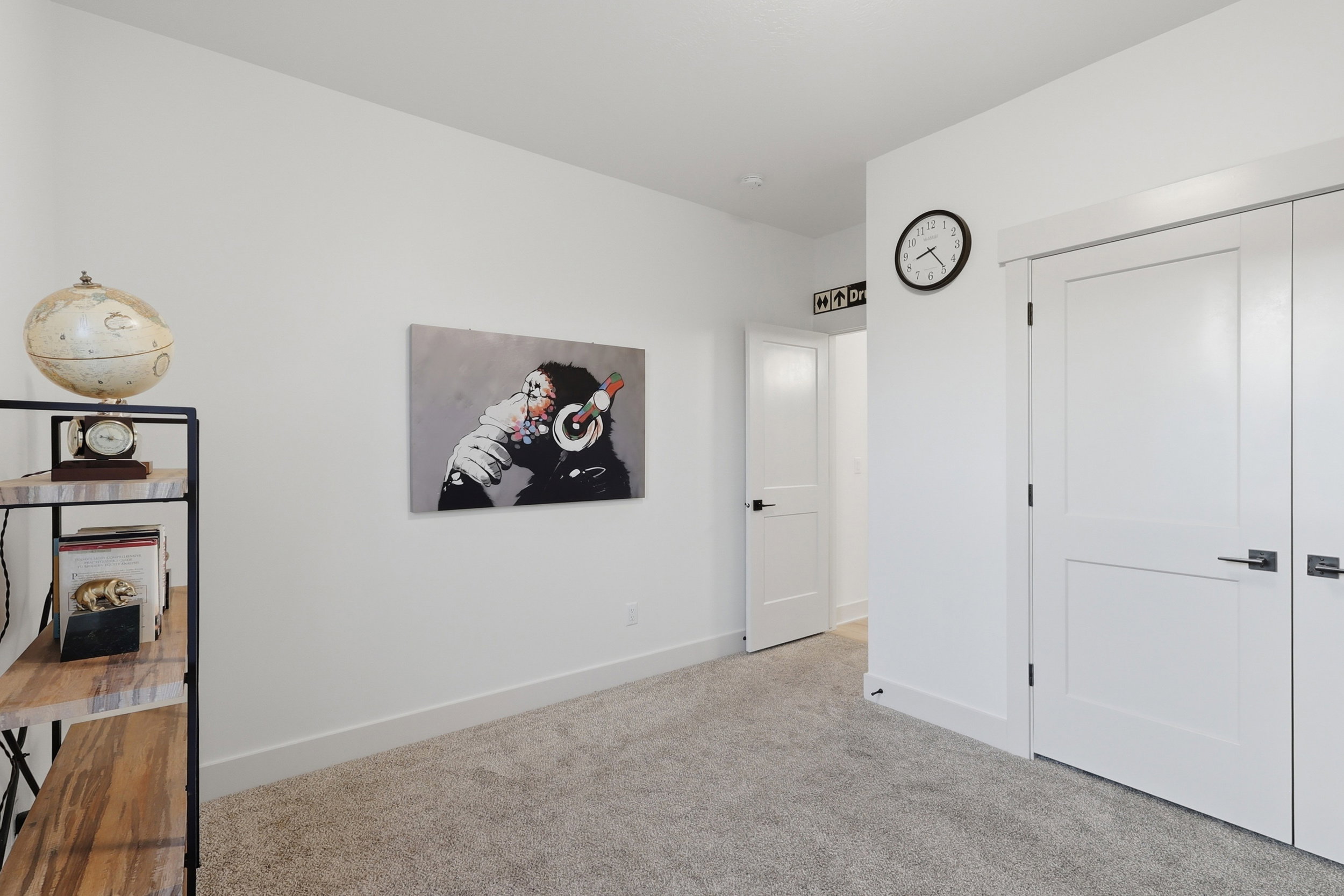 #3 White interior walls with a light-colored carpet flooring