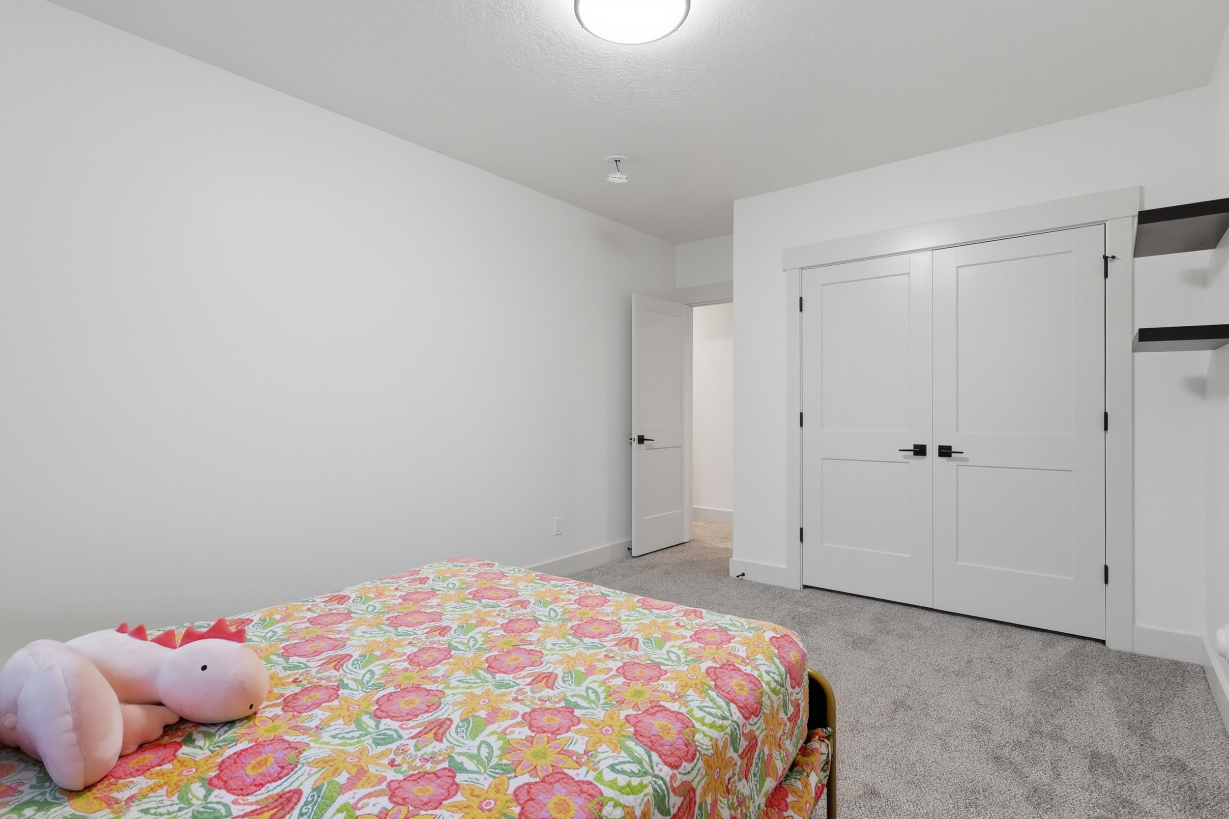#4 Bedroom featuring neutral gray carpet flooring, white walls, and a flush mount ceiling light