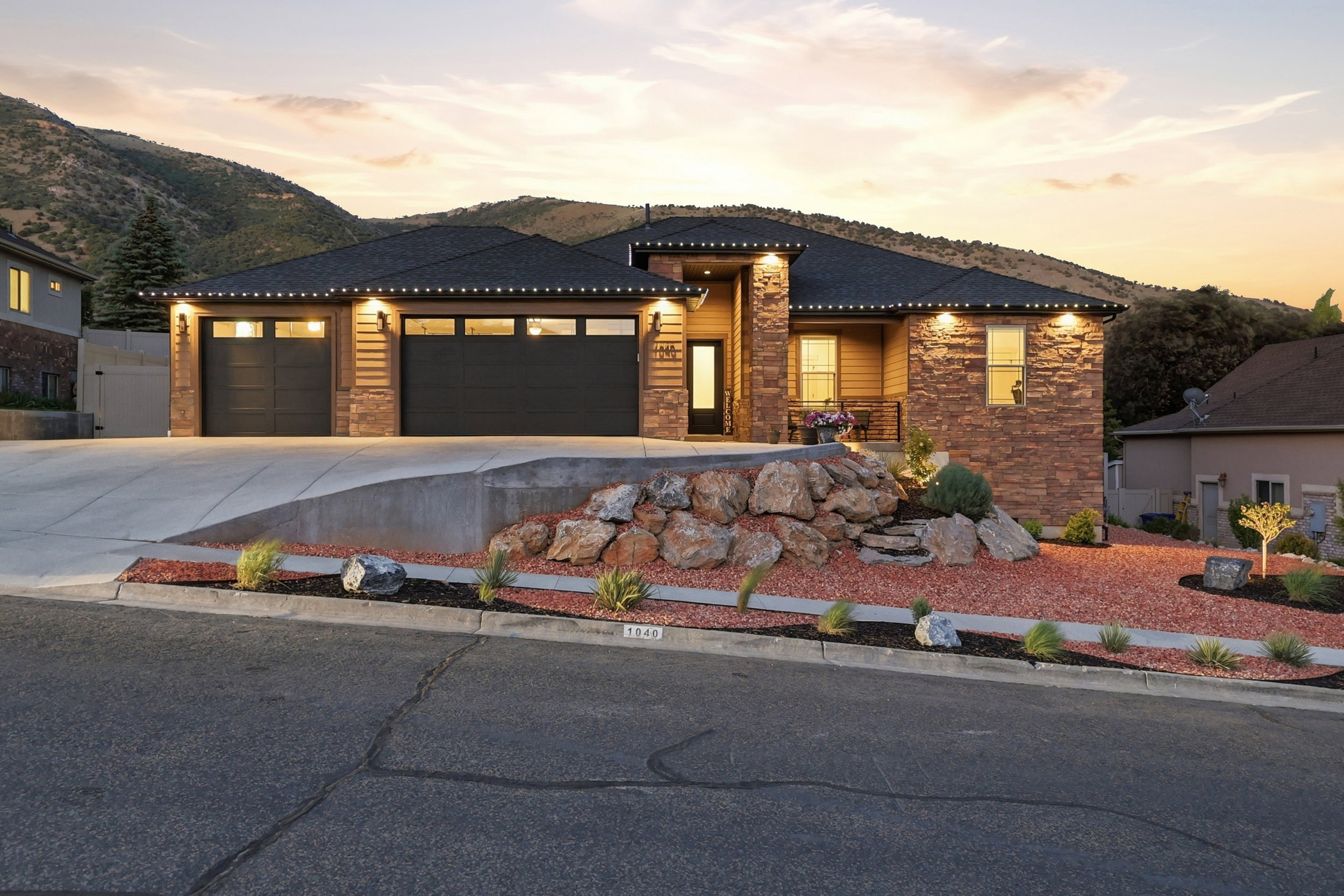 Contemporary residential exterior featuring a stone and siding facade