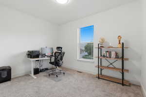 #3 Room featuring a large window, light-colored walls, and neutral carpet flooring
