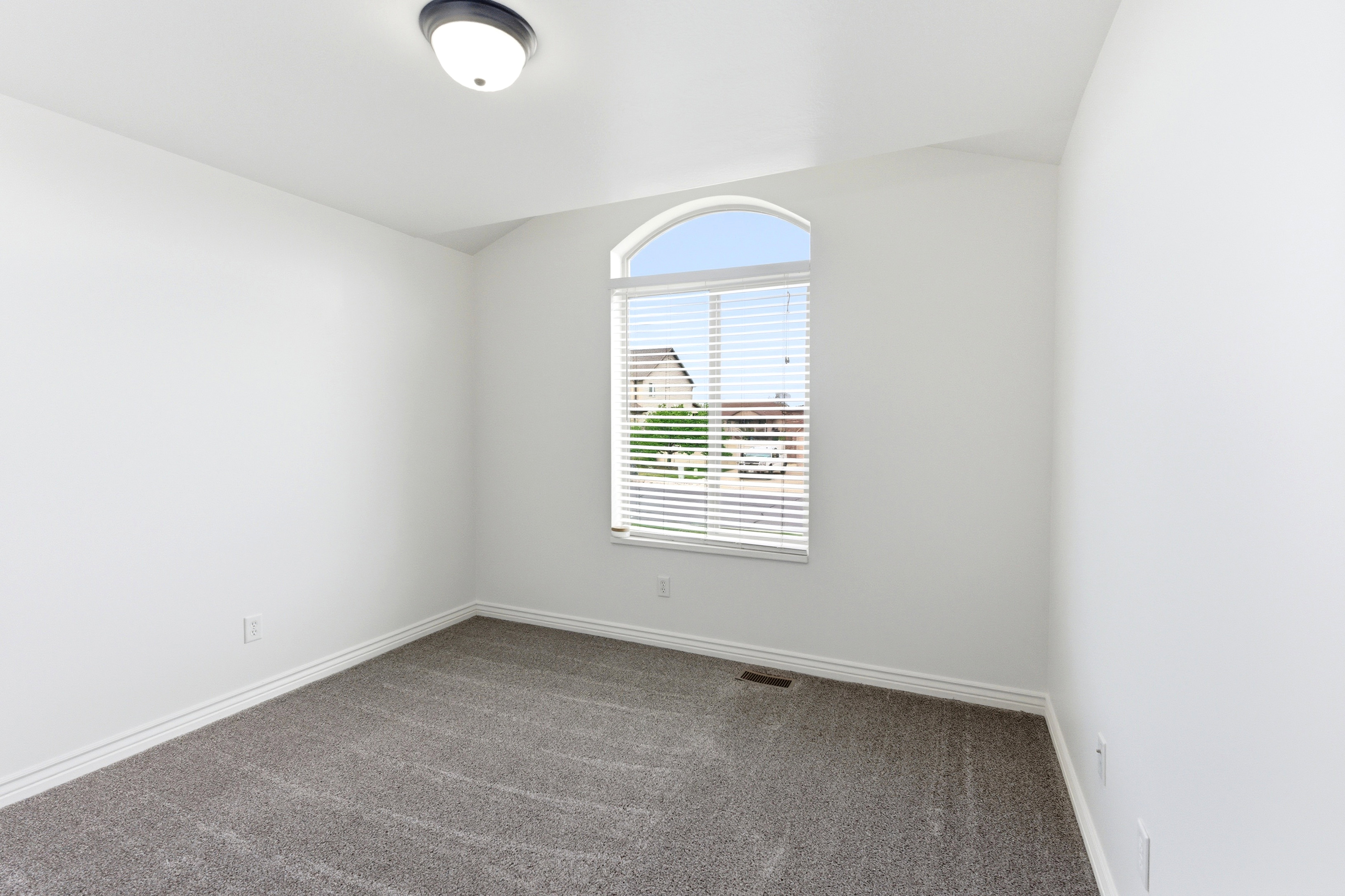 Arched window with horizontal blinds