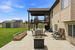 Expansive concrete patio with a covered upper deck