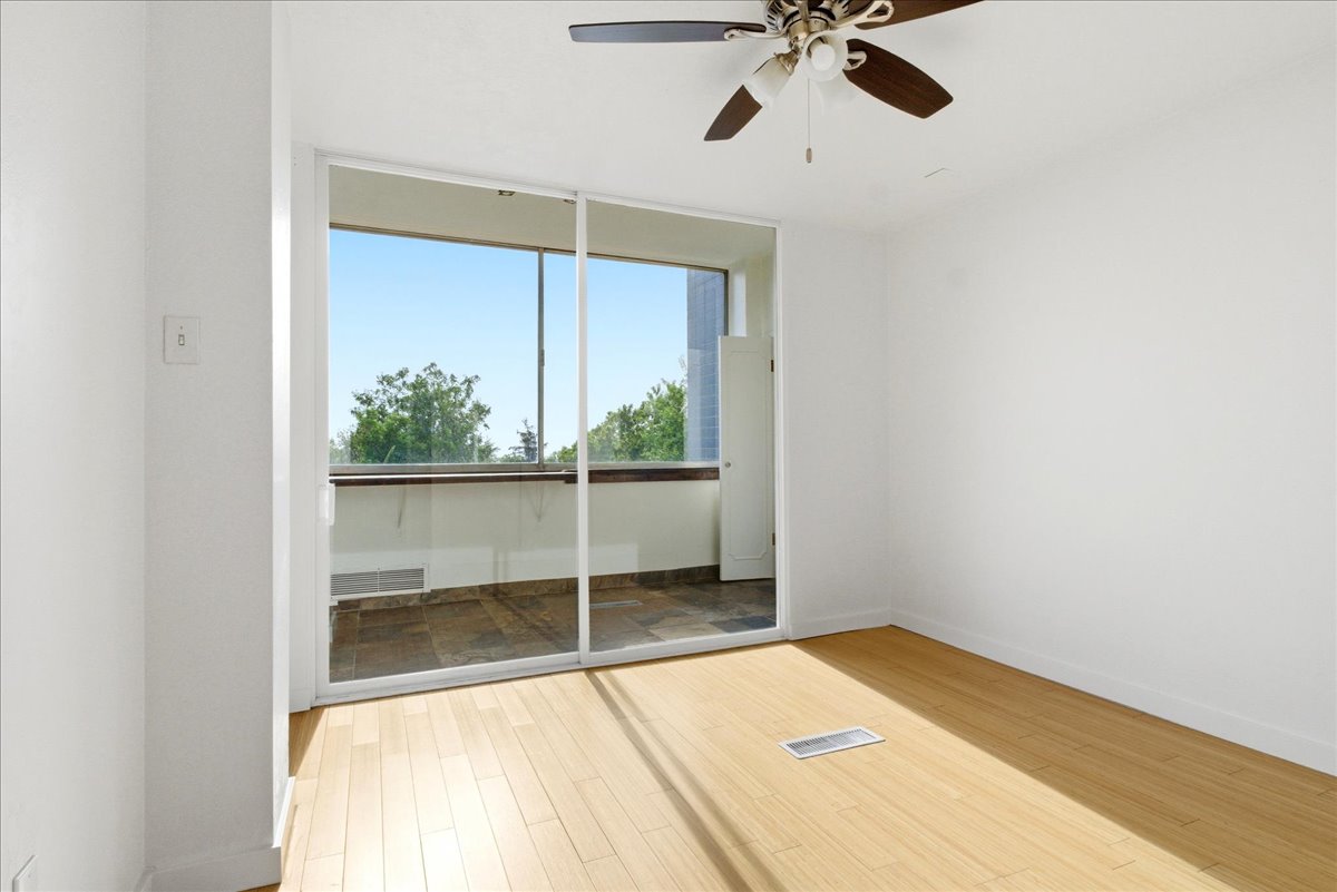 Interior room with light wood-finish flooring and white walls