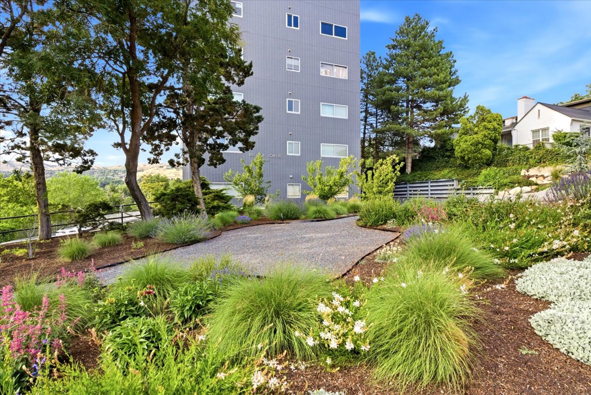 Multi-story building with a gray facade and multiple windows