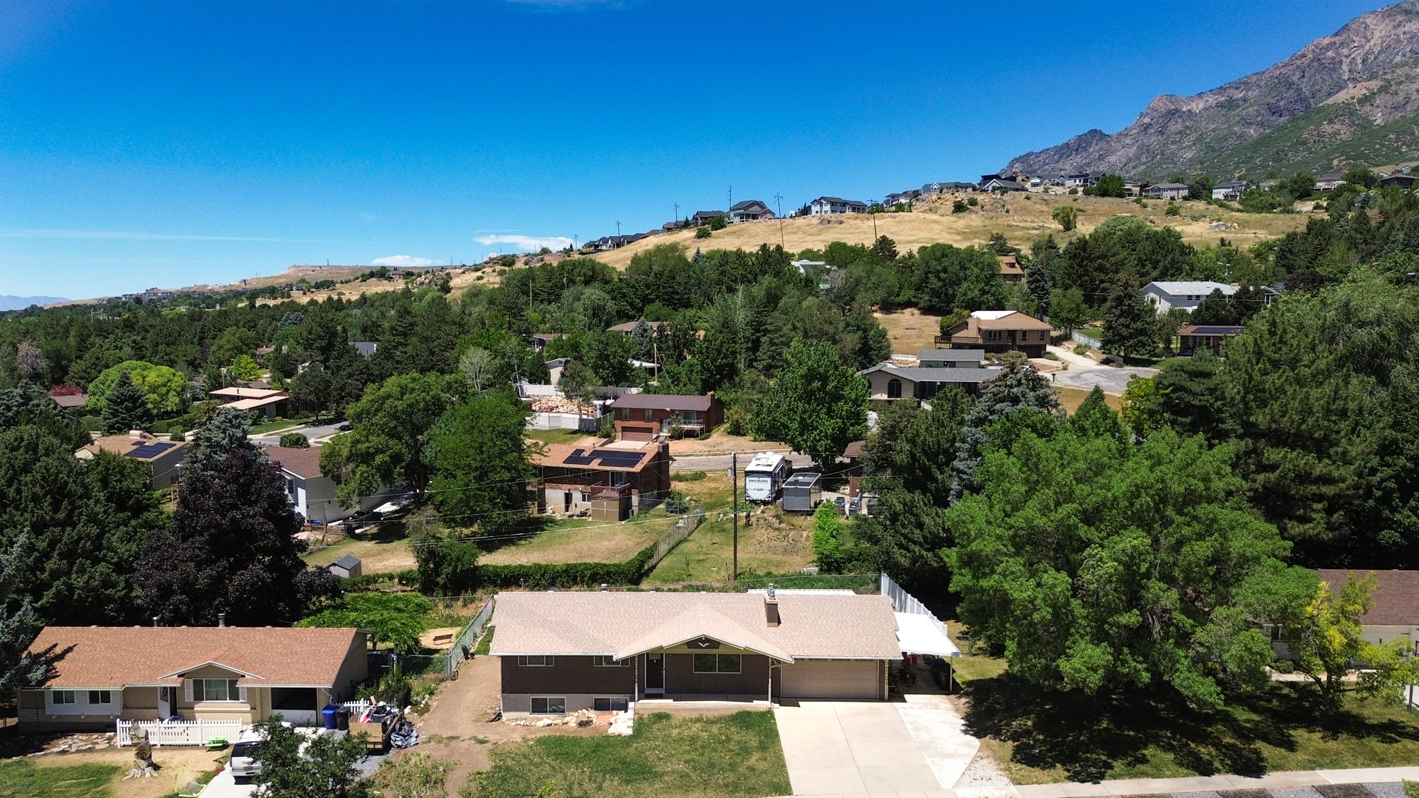 Ranch-style residence featuring a single-story design, an attached two-car garage, and a concrete driveway
