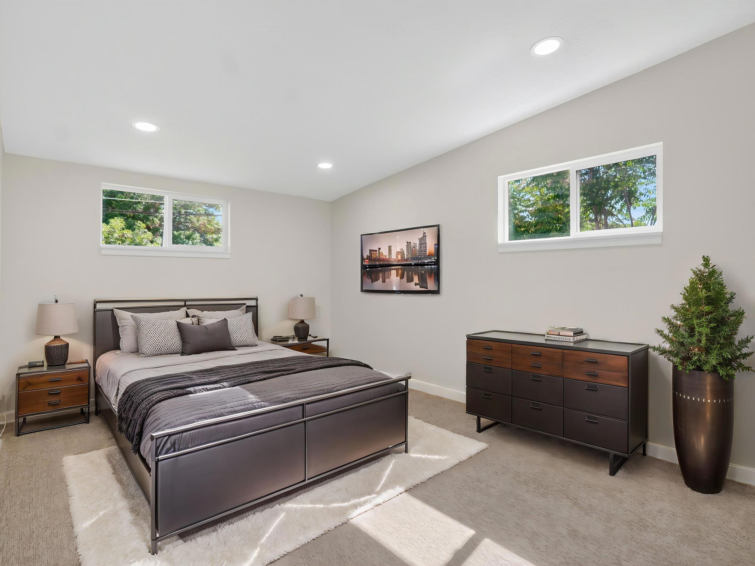 *Virtually Staged* Spacious sleeping area featuring carpeted flooring and recessed lighting