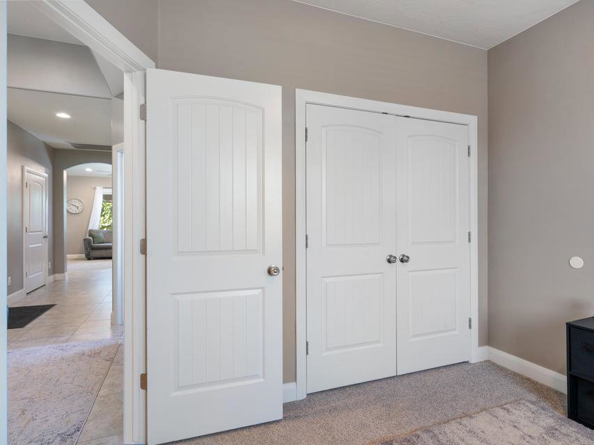 White paneled doors with chrome hardware
