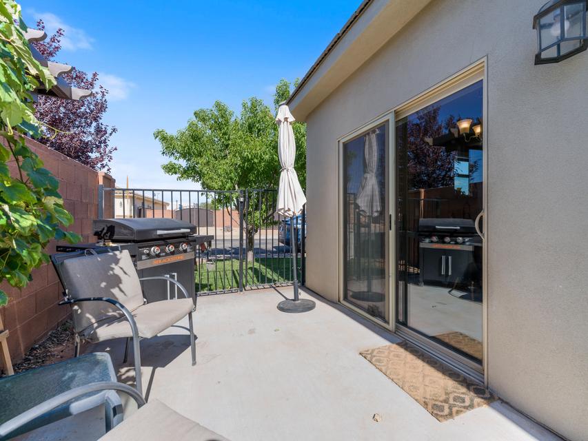 Concrete patio with a sliding glass door entry