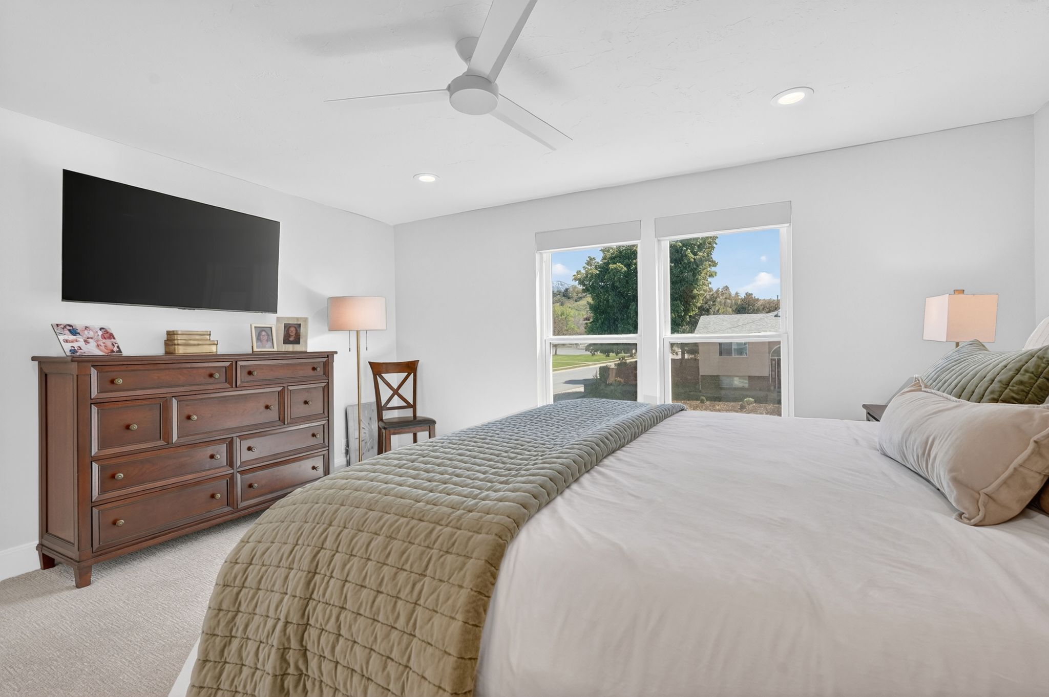 Primary bedroom with automatic blackout shades