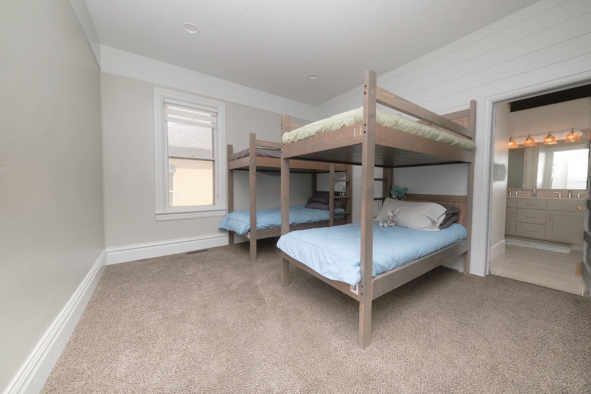 Carpeted room bedroom with recessed lighting