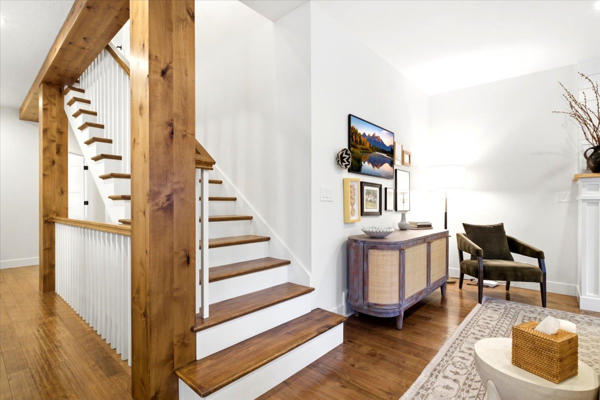 Hardwood flooring extending from the entry to the living area