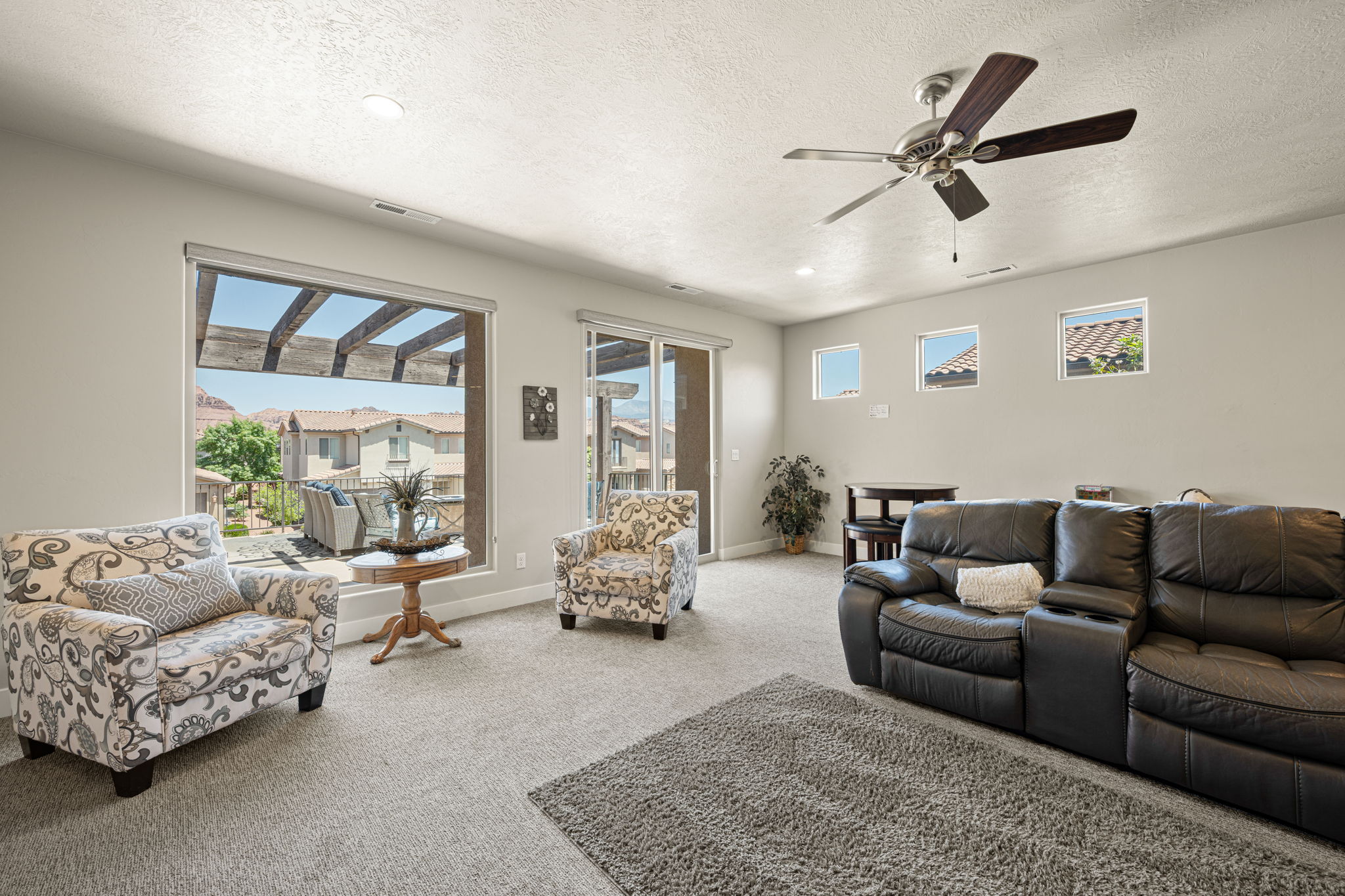 Carpeted interior space featuring neutral wall tones and recessed lighting