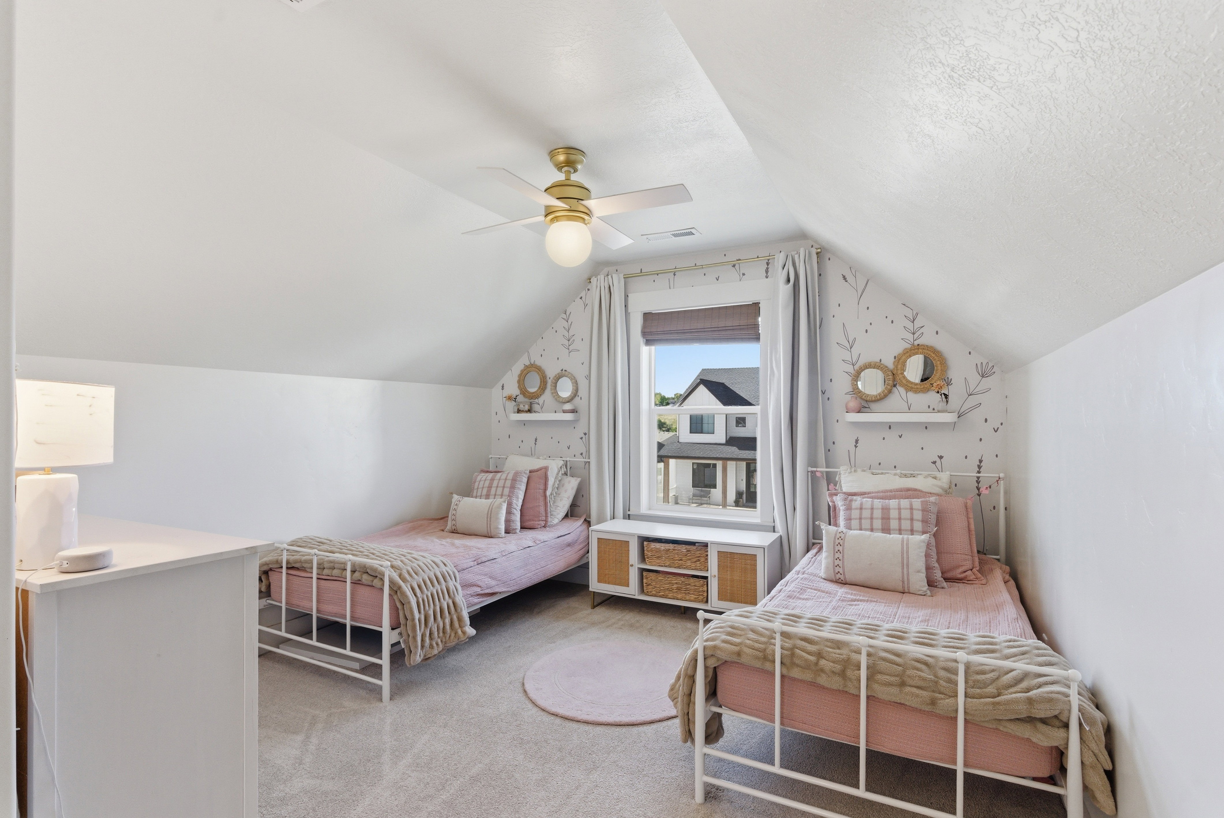 Attic room with sloped ceilings and light-colored carpeting