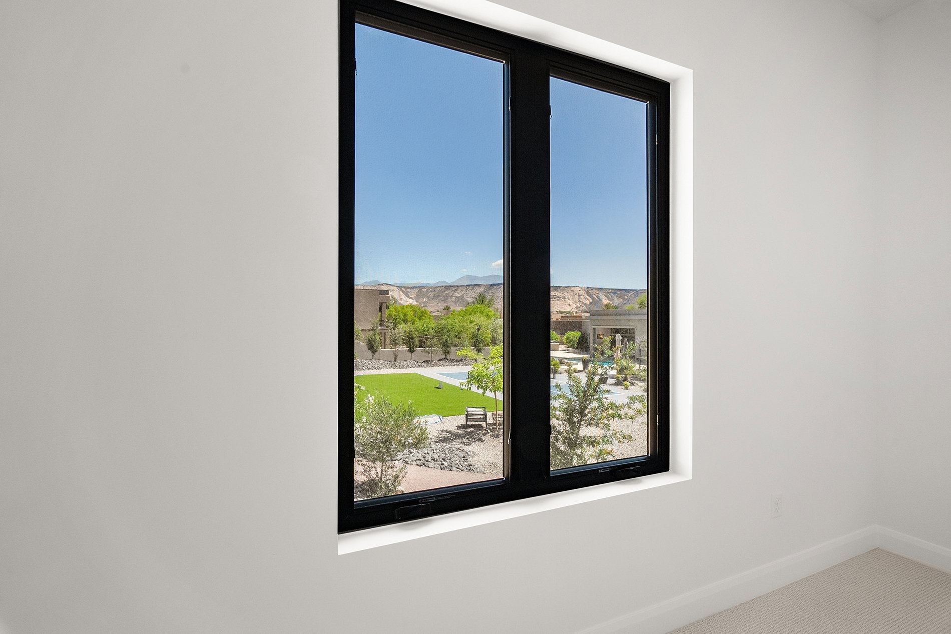 Black-framed window offering expansive outdoor scenery